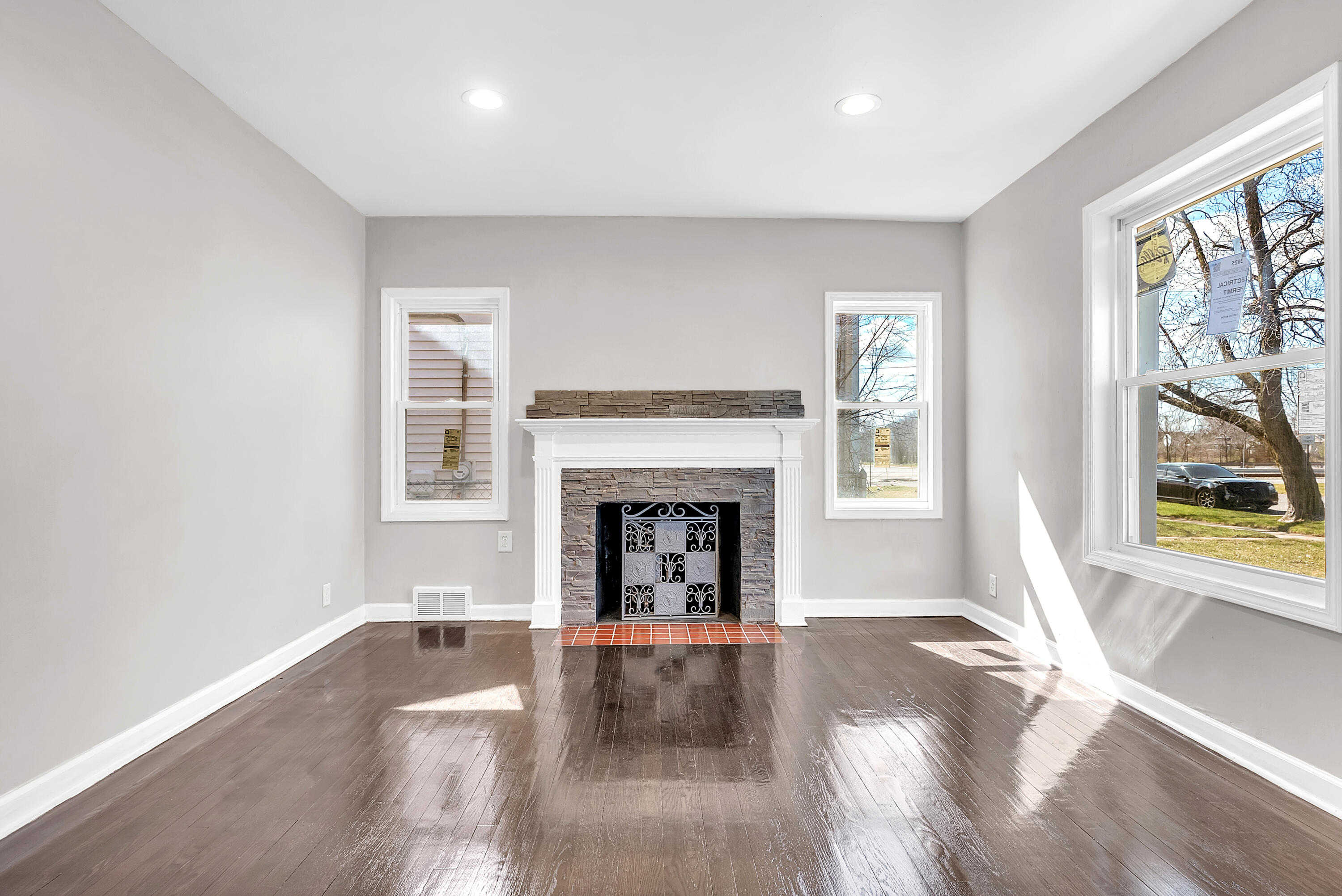 263 Rutledge Street Gary, IN 46404 - Photo 7 of 21 a view of a livingroom with a fireplace and window