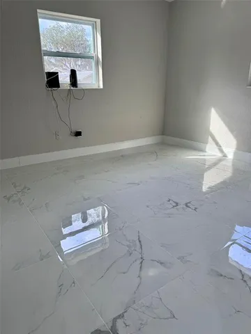 a bathroom with a sink a toilet a mirror and shower curtain