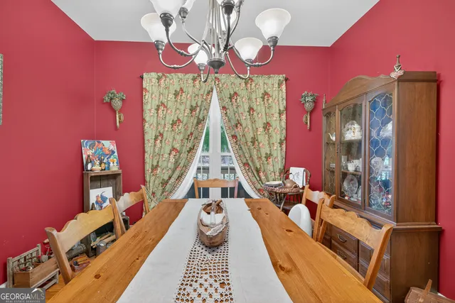 a white bath tub sitting next to a white sink and vanity