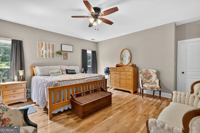 a living room with patio furniture and a large window