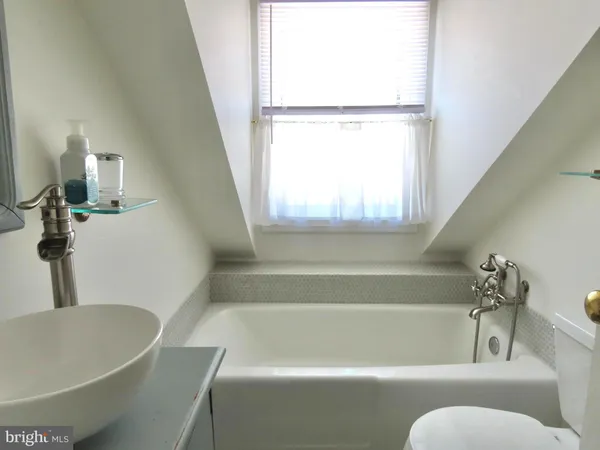 a bathroom with a sink and a bathtub