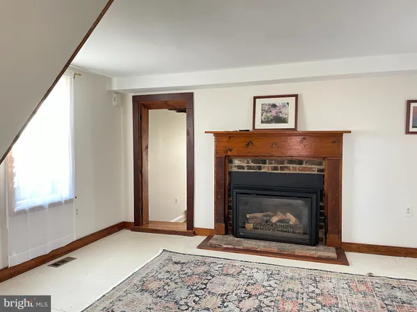 a living room with a fireplace