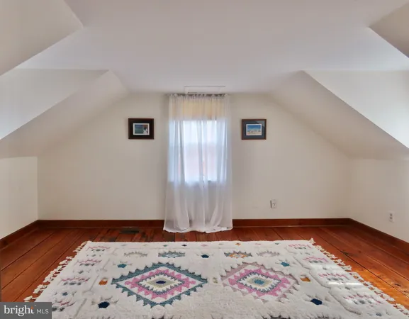 a bathroom with a sink mirror and vanity
