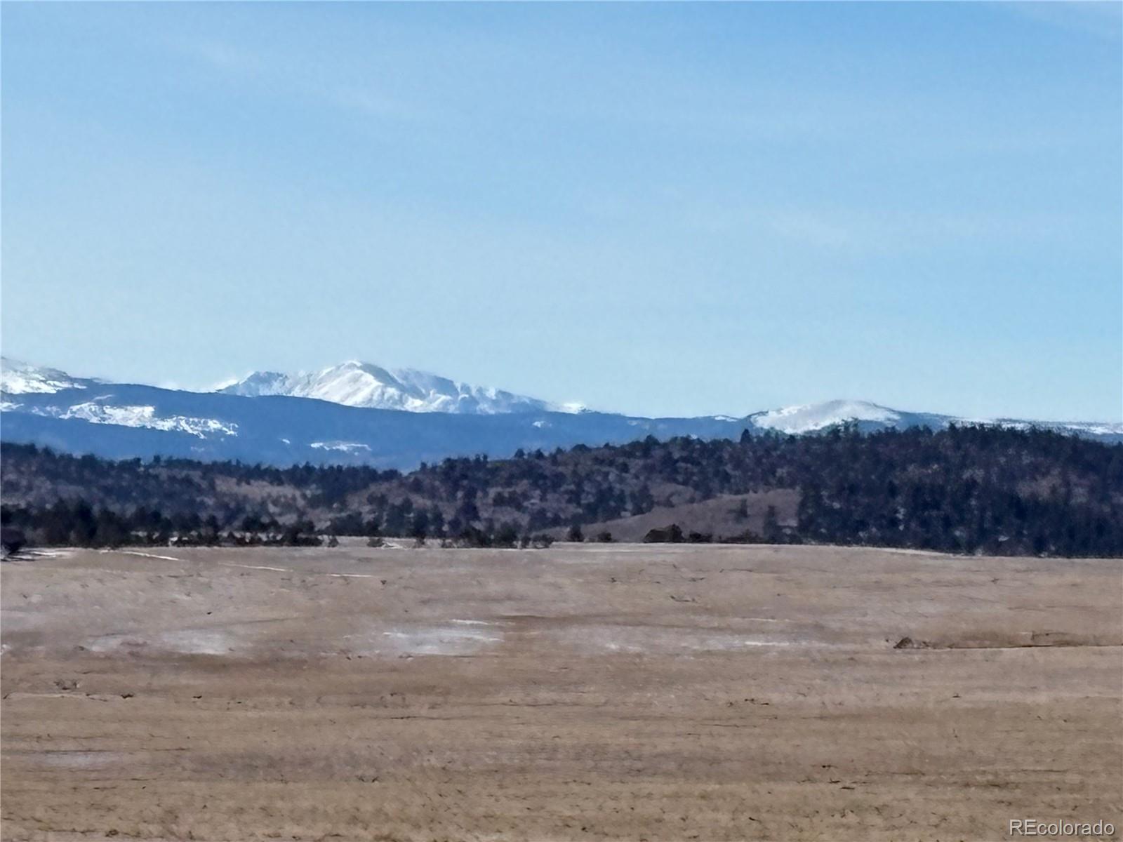 809 Rocky Mountain Road Hartsel, CO 80449 - Photo 2 of 26 a view of mountain and a lake view