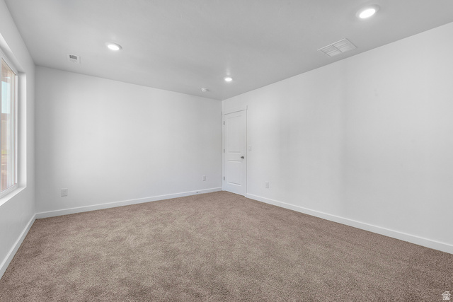 788 West 2840 South, Unit 2 Logan, UT 84321 - Photo 18 of 21 Expansive room featuring neutral-toned carpeting, white walls, and recessed lighting
