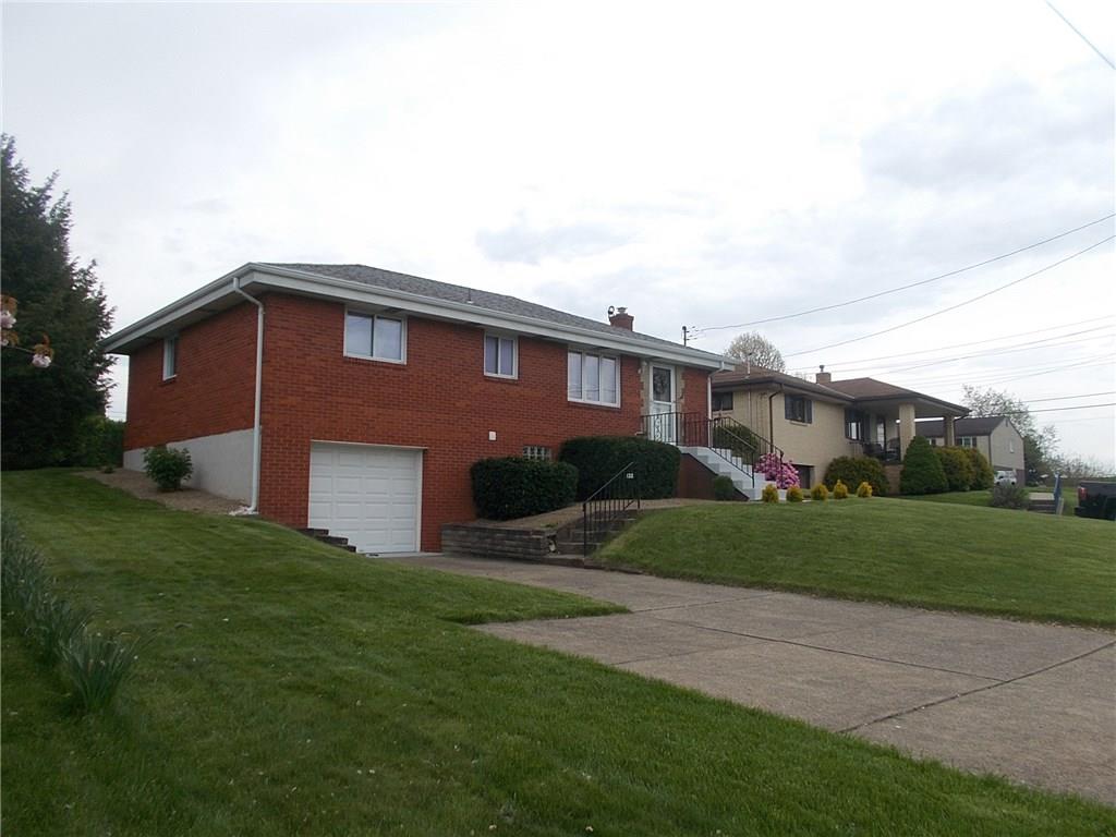 132 Starling Drive McKees Rocks, PA 15136 - Photo 2 of 25 Additional view reveals solid brick exterior, well manicured lawns, concrete driveway in good condition and extra parking pad. Ample parking for convenience and guests. Great residential neighborhood!!