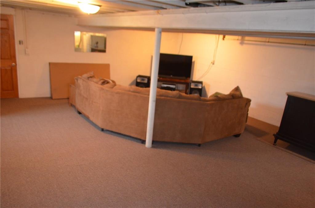 132 Starling Drive McKees Rocks, PA 15136 - Photo 19 of 25 Partially finished game room with newer indoor/outdoor rug, walls and ceiling are painted