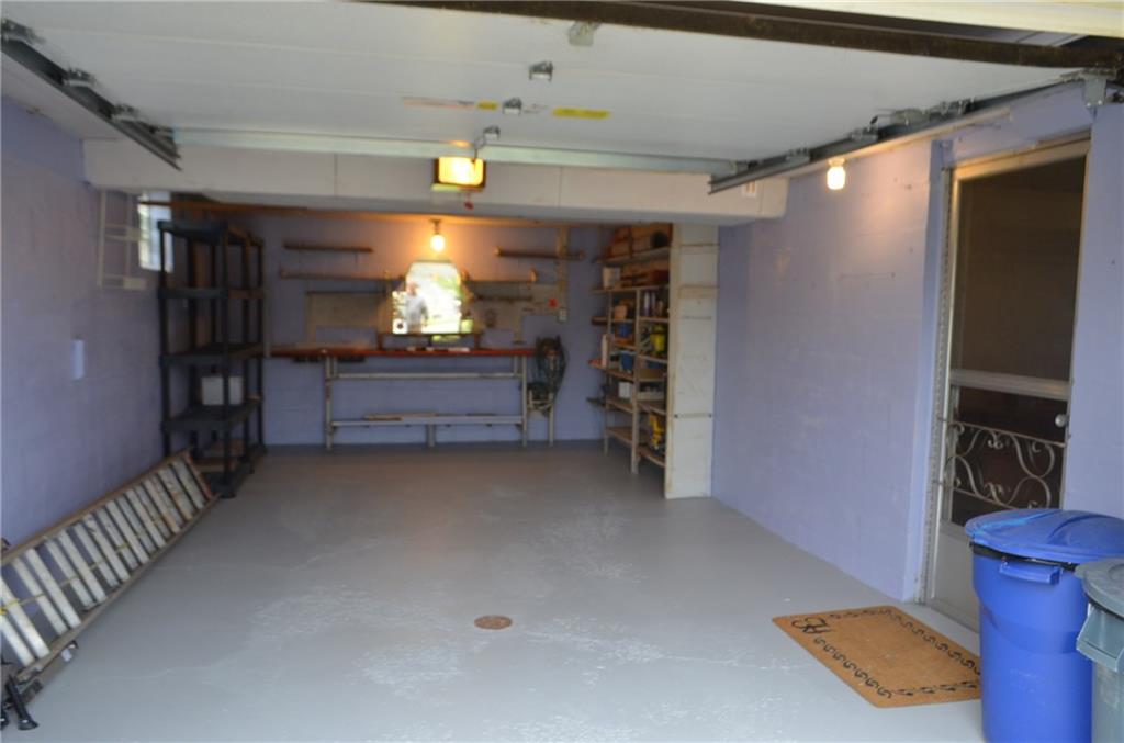 132 Starling Drive McKees Rocks, PA 15136 - Photo 24 of 25 Inside the one car integral garage / deep enough for storage, floor drain, updated garage door with automatic garage door opener. Glass block basement windows.