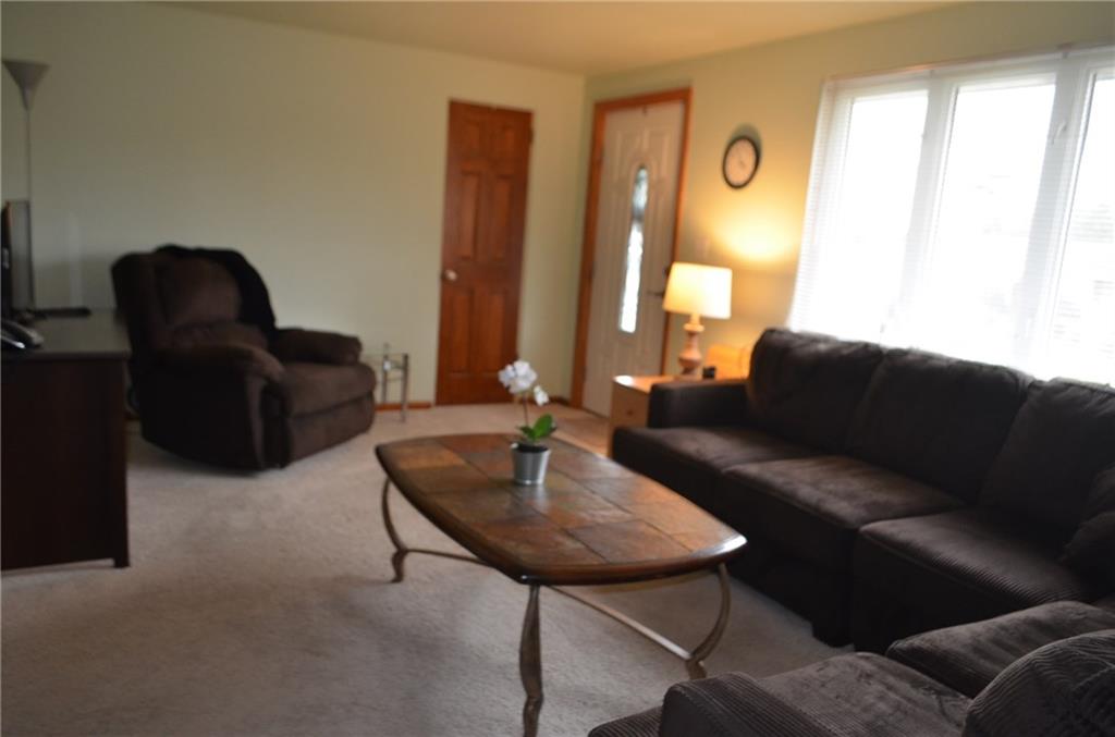 132 Starling Drive McKees Rocks, PA 15136 - Photo 7 of 25 Living Room / Light n' bright with the large casement picture window, freshly painted, neutral wall to wall carpeting, entrance closet (also accesses attic)