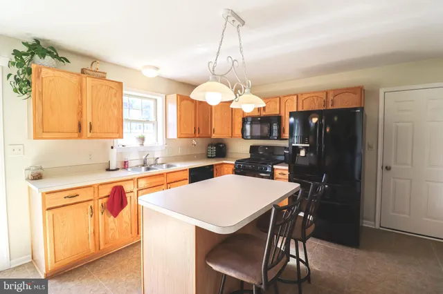 a bathroom with a sink mirror and toilet