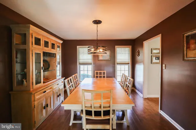 a spacious bedroom with a bed and a flat screen tv