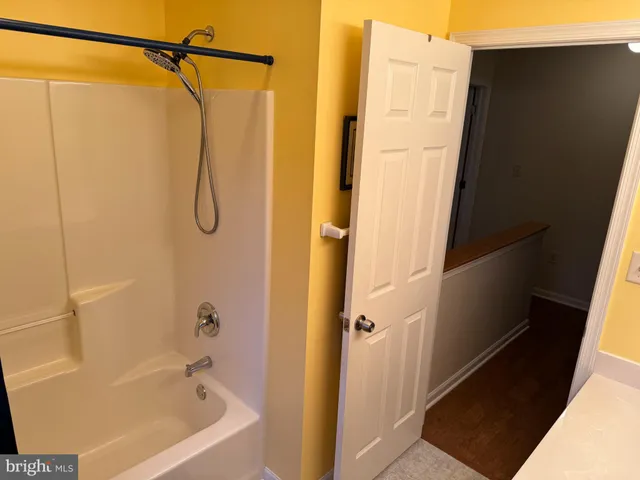 a view of a patio with a table chairs and a backyard