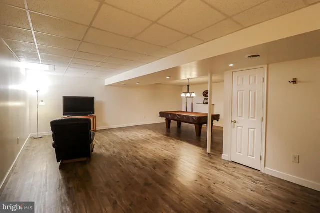 a view of a house with a yard and sitting area