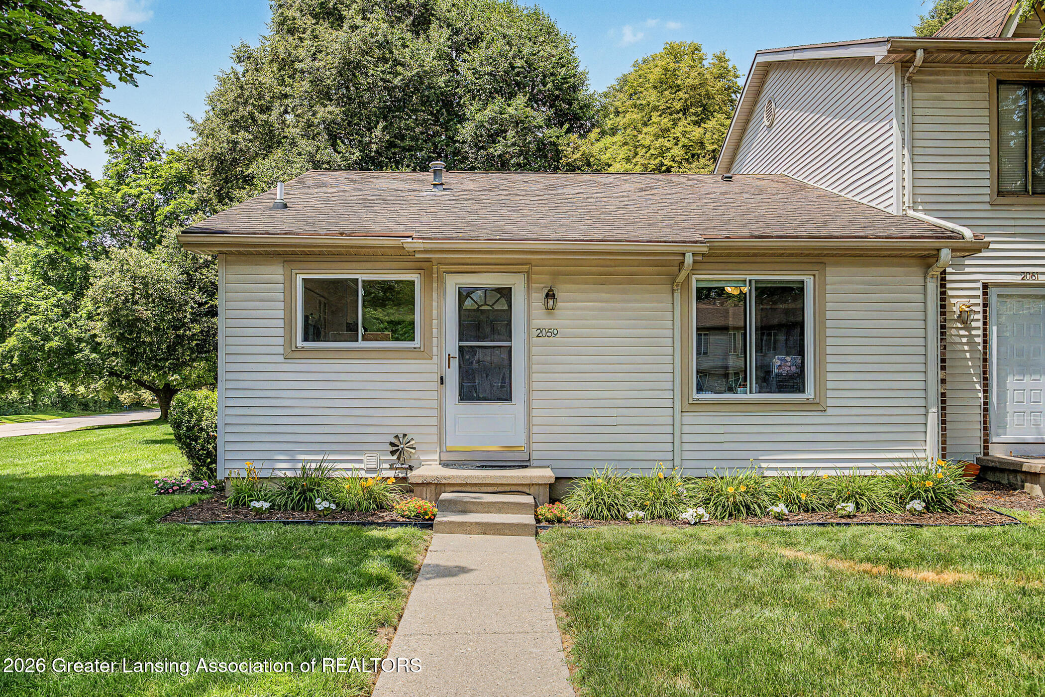 2059 La Mer Lane, Unit 17 Haslett, MI 48840 - Photo 2 of 48 Front