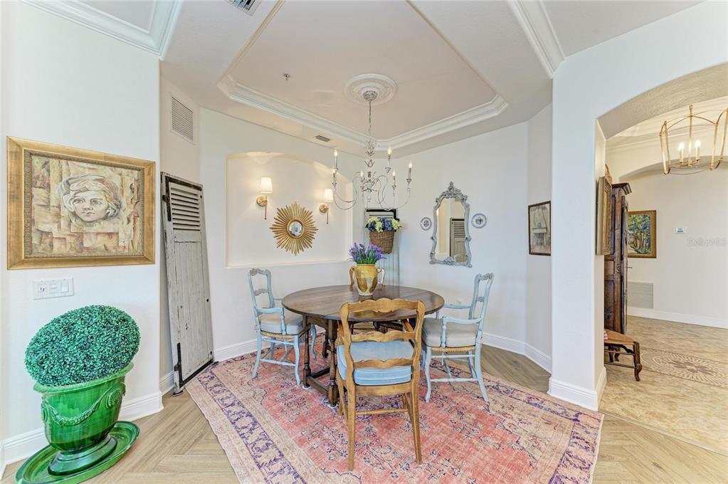 1151 Riverscape Street, Unit 1151 Bradenton, FL 34208 - Photo 11 of 62 a view of a dining room with furniture window and wooden floor