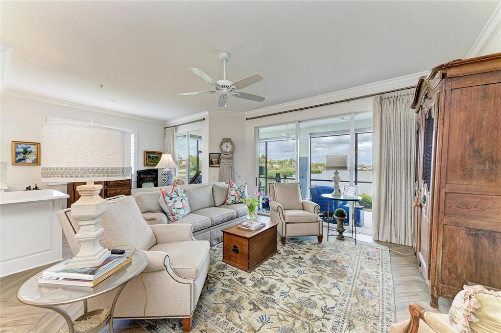 1151 Riverscape Street, Unit 1151 Bradenton, FL 34208 - Photo 13 of 62 a living room with furniture and a large window