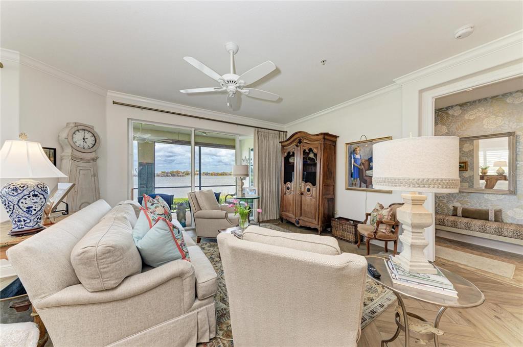 1151 Riverscape Street, Unit 1151 Bradenton, FL 34208 - Photo 14 of 62 a living room with furniture and a large window