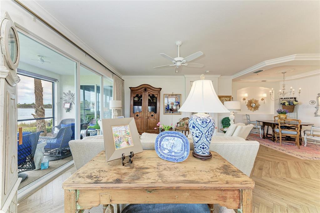 1151 Riverscape Street, Unit 1151 Bradenton, FL 34208 - Photo 15 of 62 a living room with furniture and wooden floor