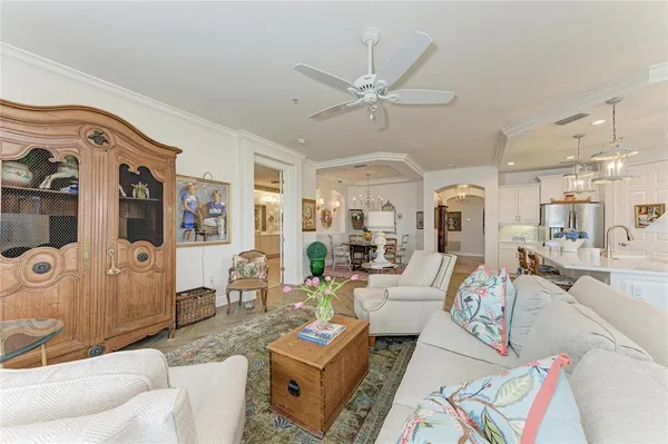 a kitchen with refrigerator cabinets dining table and chairs