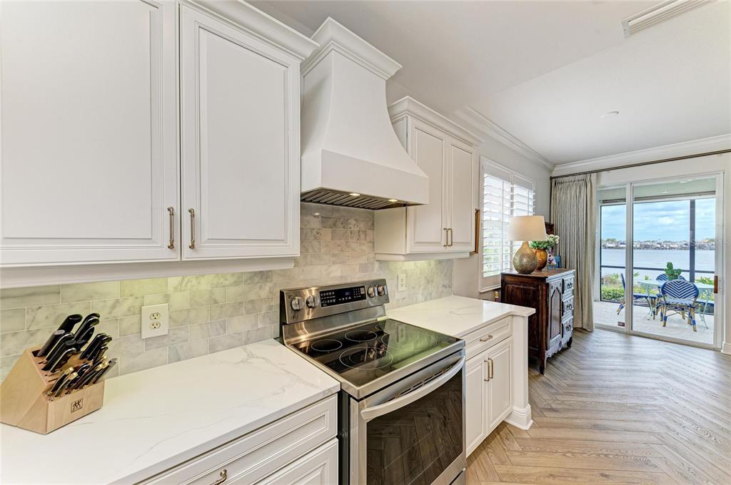 1151 Riverscape Street, Unit 1151 Bradenton, FL 34208 - Photo 25 of 62 a kitchen with a stove and a sink