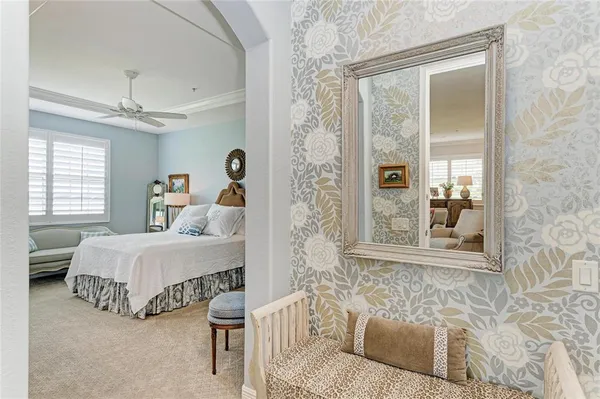 a spacious bathroom with a shower sink and mirror