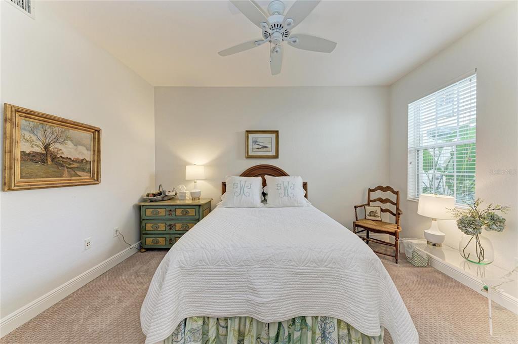 1151 Riverscape Street, Unit 1151 Bradenton, FL 34208 - Photo 37 of 62 a bedroom with a bed and wooden floor
