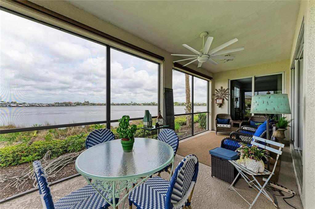 1151 Riverscape Street, Unit 1151 Bradenton, FL 34208 - Photo 40 of 62 a dining room with furniture window and outside view