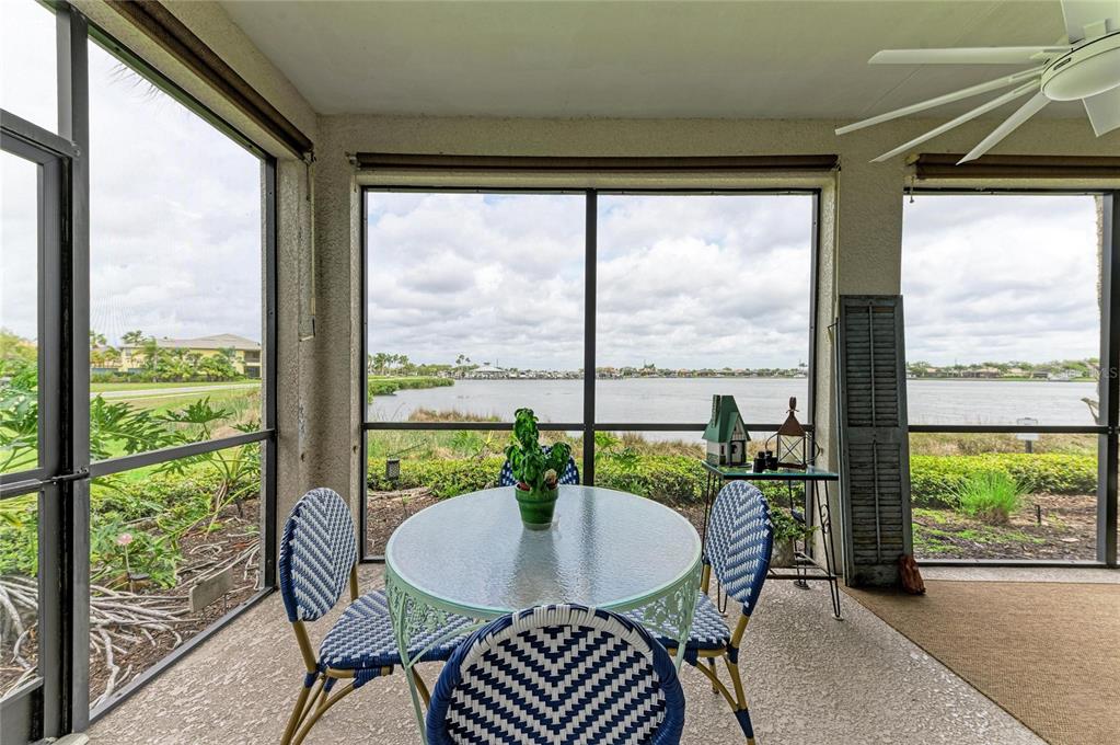 1151 Riverscape Street, Unit 1151 Bradenton, FL 34208 - Photo 42 of 62 a dining room with furniture window and outside view