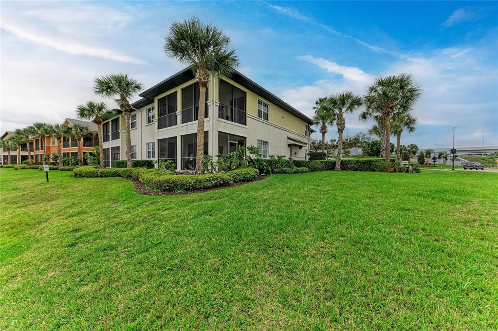 1151 Riverscape Street, Unit 1151 Bradenton, FL 34208 - Photo 44 of 62 a front view of a house with garden