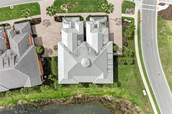 a view of a patio with table and chairs with wooden floor and fence