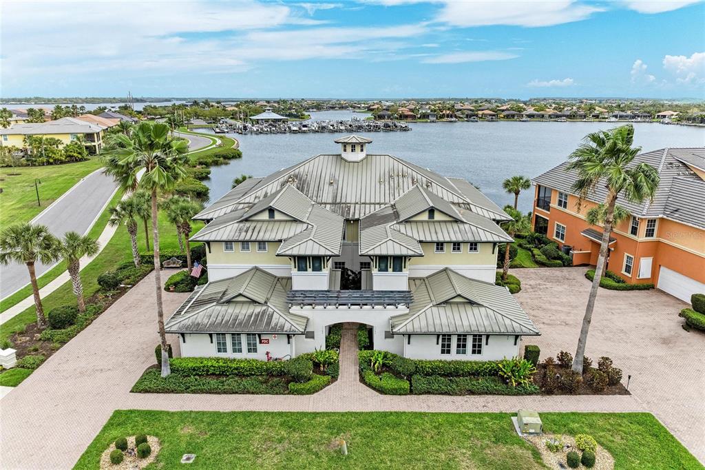 1151 Riverscape Street, Unit 1151 Bradenton, FL 34208 - Photo 49 of 62 an aerial view of residential houses with outdoor space and ocean view