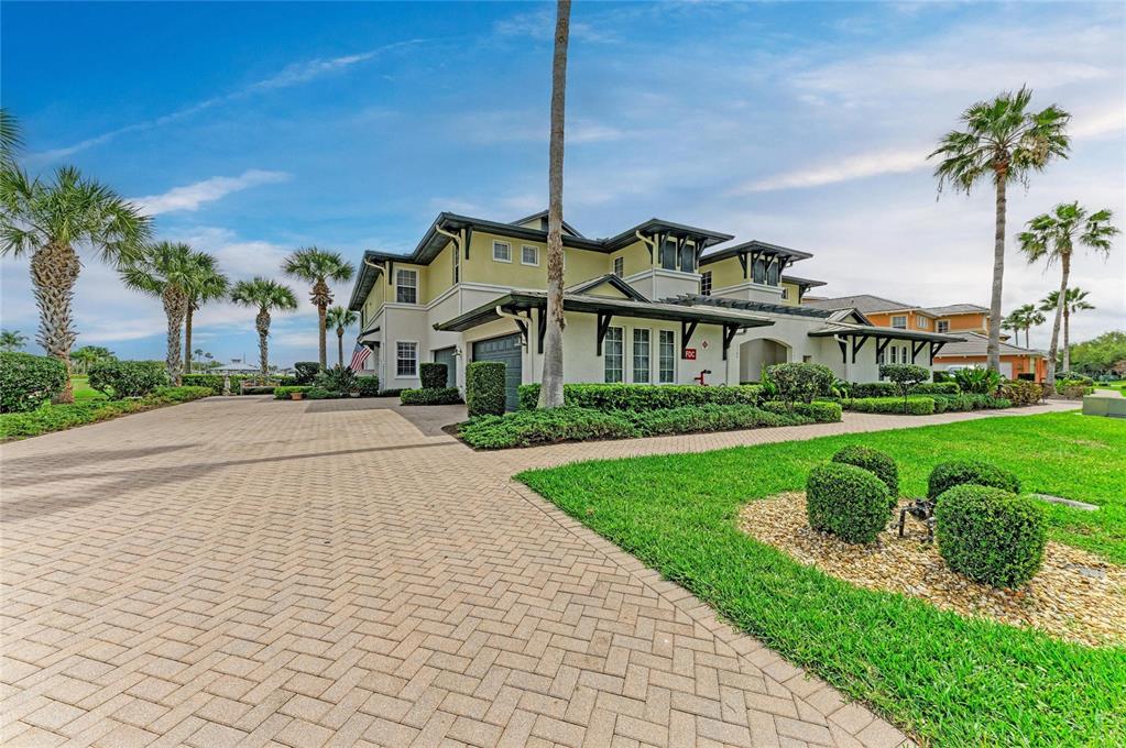 1151 Riverscape Street, Unit 1151 Bradenton, FL 34208 - Photo 5 of 62 a front view of a house with a yard