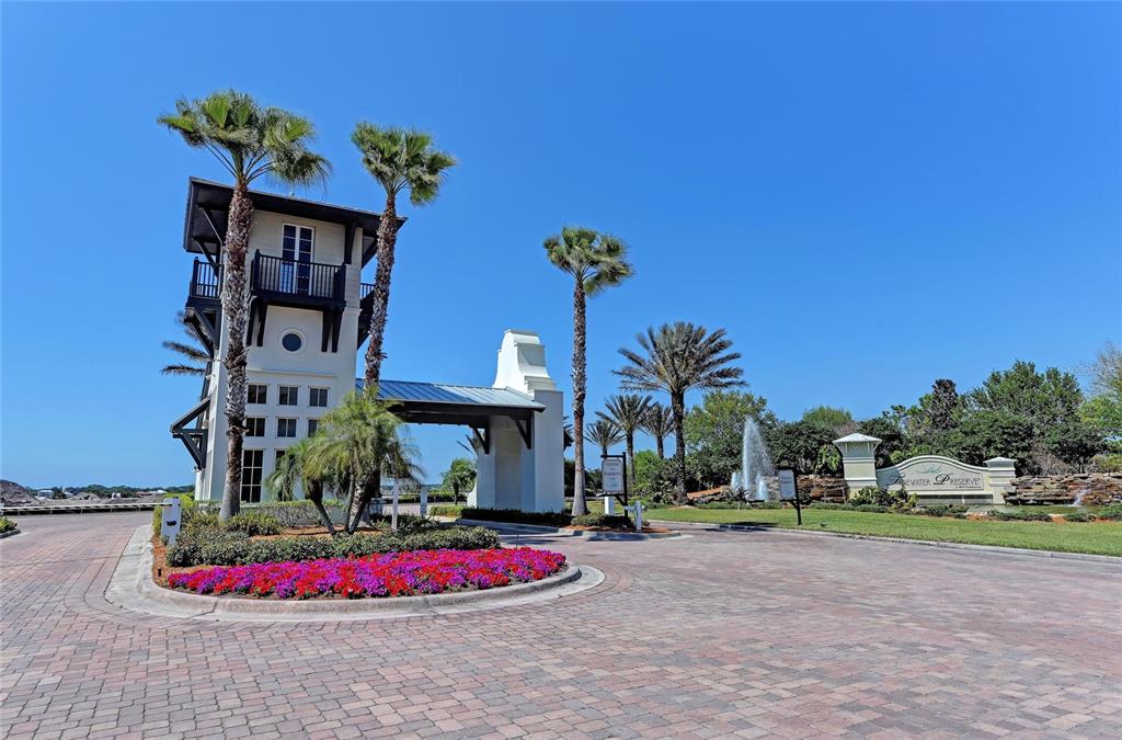 1151 Riverscape Street, Unit 1151 Bradenton, FL 34208 - Photo 61 of 62 a front view of a house with a yard