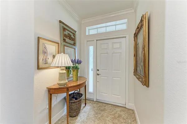 a living room with lots of furniture and a chandelier