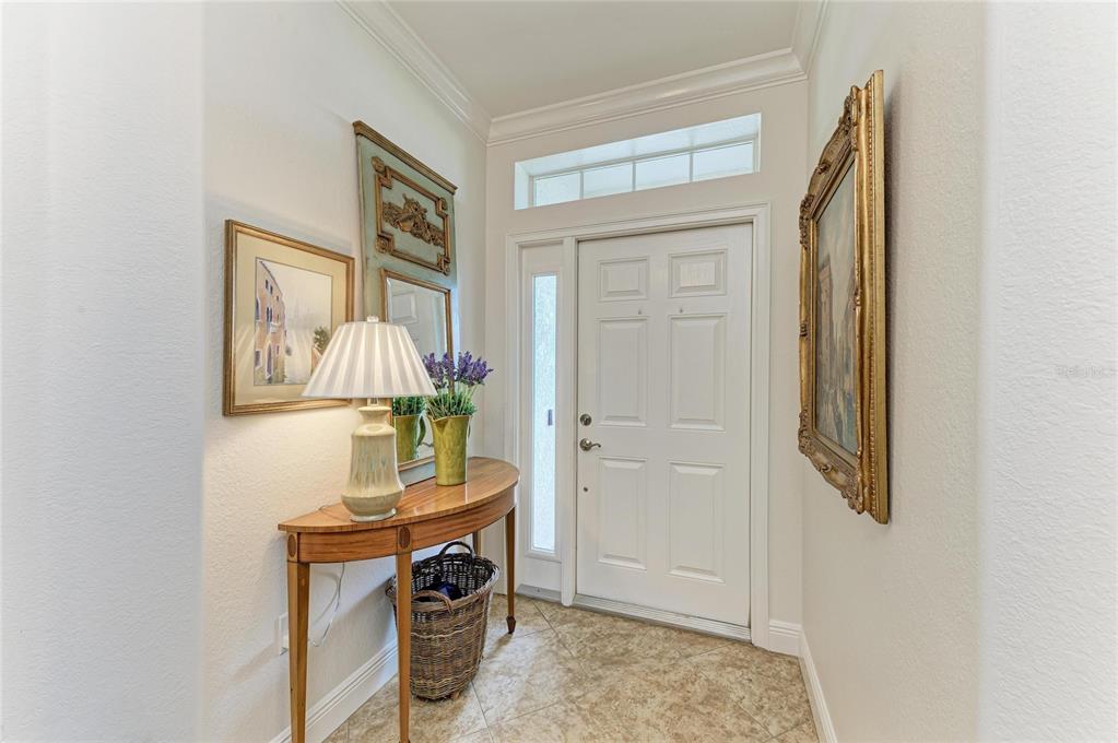 1151 Riverscape Street, Unit 1151 Bradenton, FL 34208 - Photo 8 of 62 a living room with furniture and a table