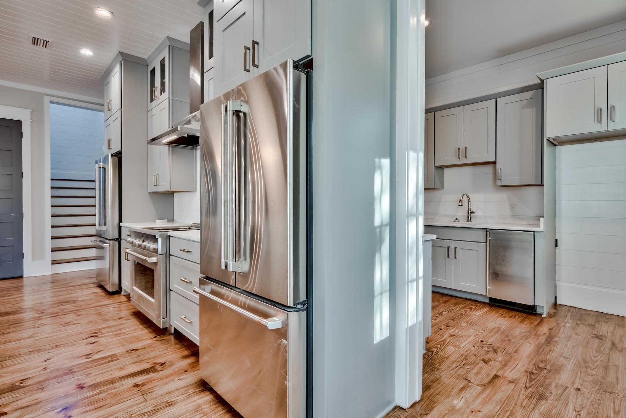 160 A St Inlet Beach Inlet Beach, FL 32461 - Photo 12 of 63 a kitchen with stainless steel appliances a refrigerator sink and cabinets