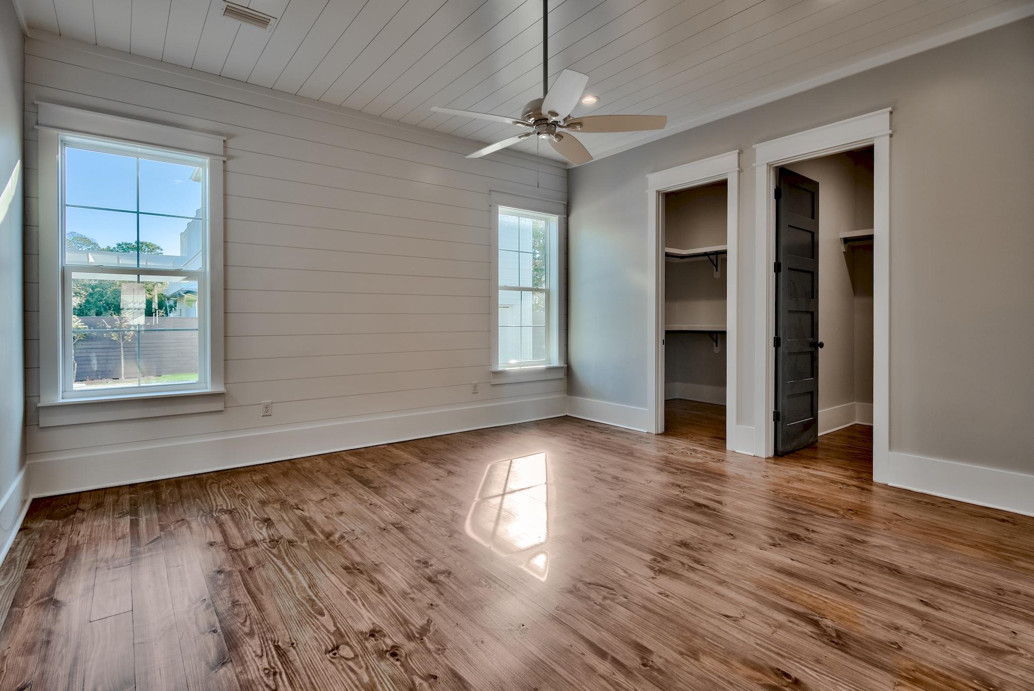 160 A St Inlet Beach Inlet Beach, FL 32461 - Photo 16 of 63 an empty room with wooden floor chandelier and windows
