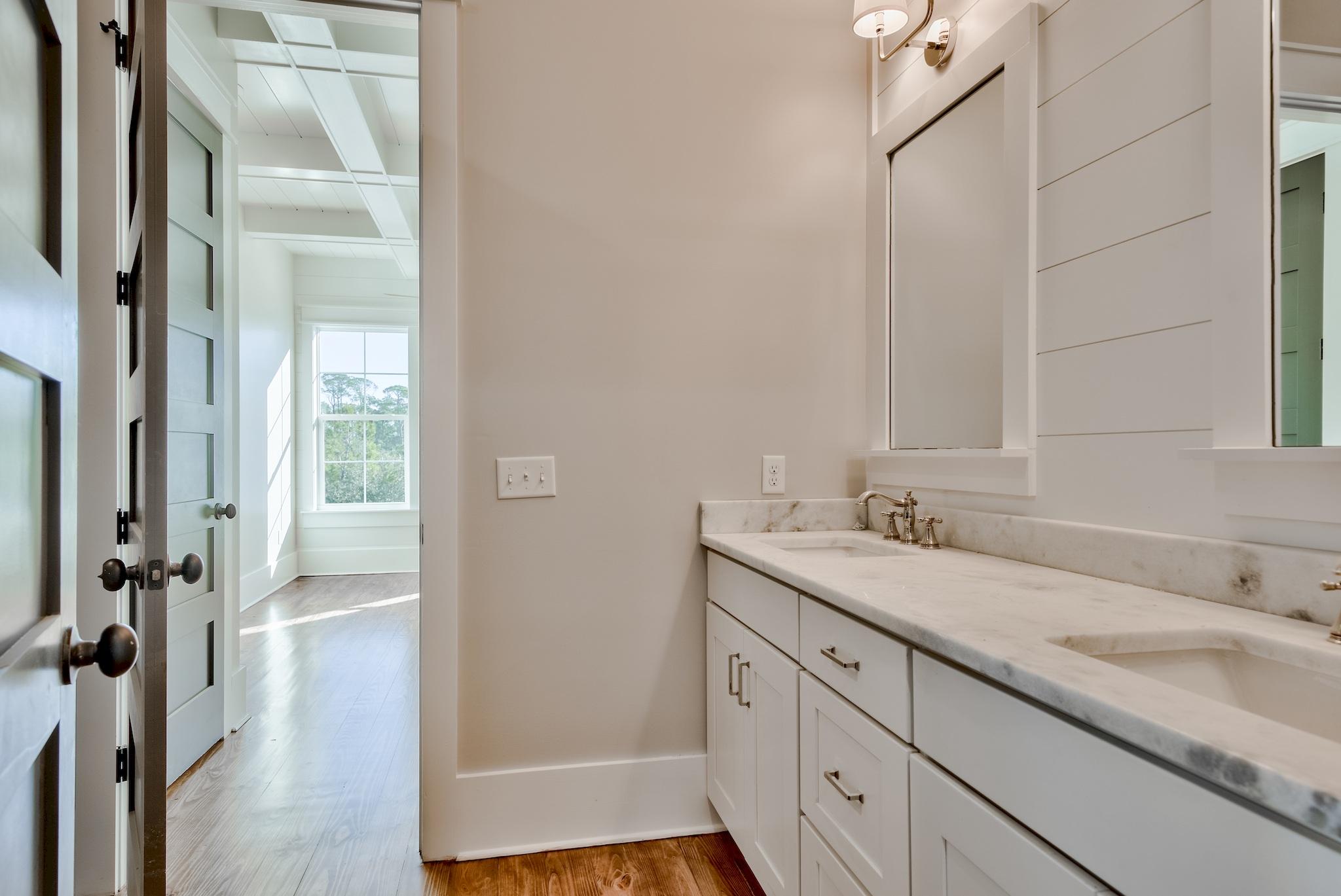 160 A St Inlet Beach Inlet Beach, FL 32461 - Photo 26 of 63 a bathroom with a granite countertop sink a mirror and a shower