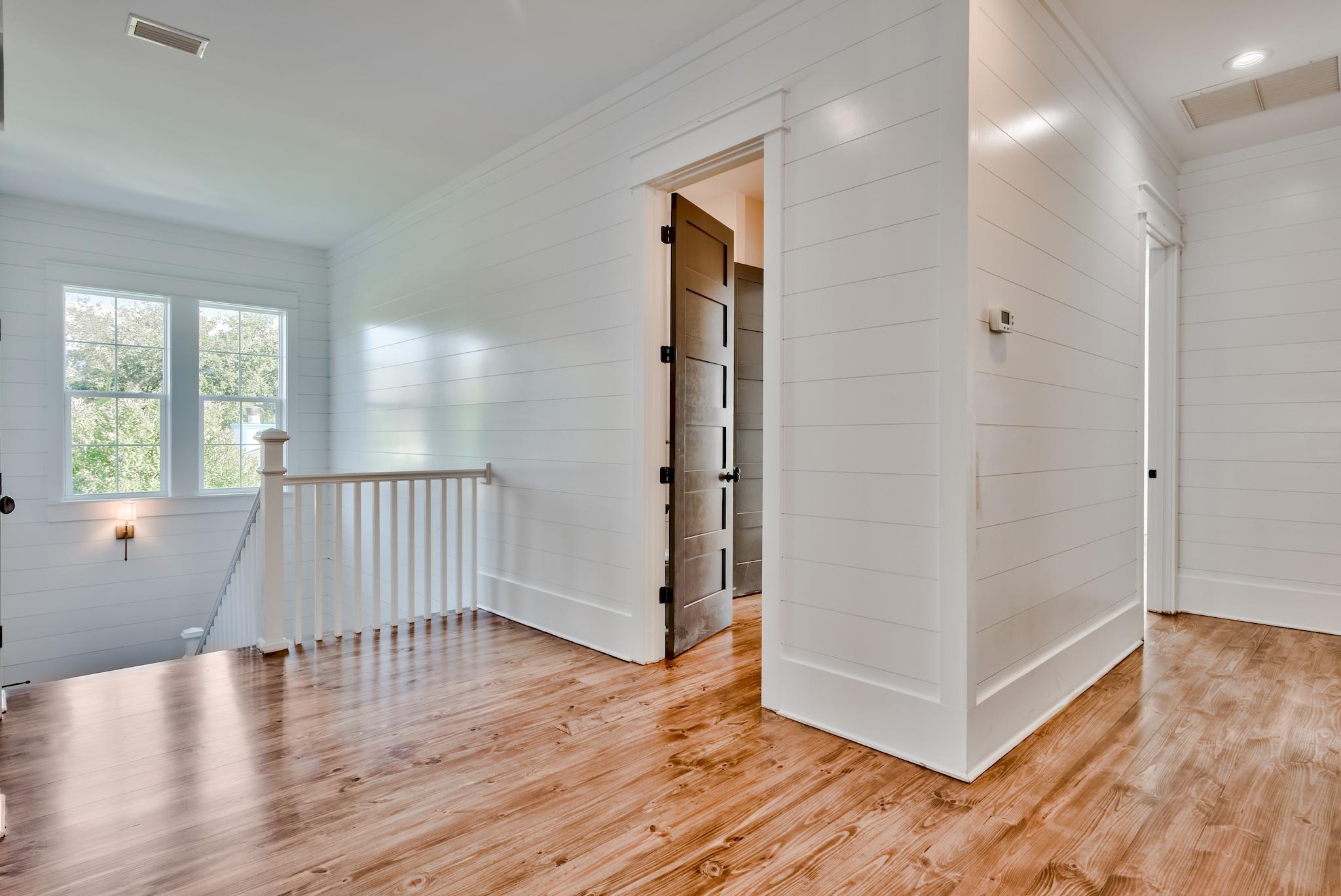 160 A St Inlet Beach Inlet Beach, FL 32461 - Photo 28 of 63 an empty room with wooden floor and windows