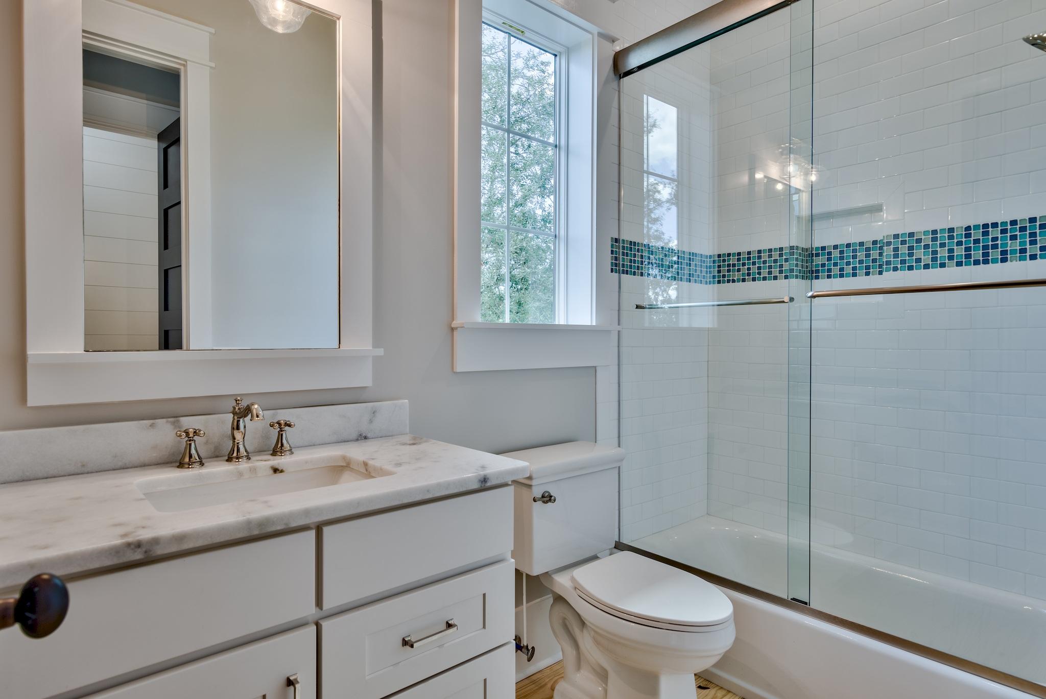 160 A St Inlet Beach Inlet Beach, FL 32461 - Photo 47 of 63 a bathroom with a granite countertop sink a toilet and a mirror