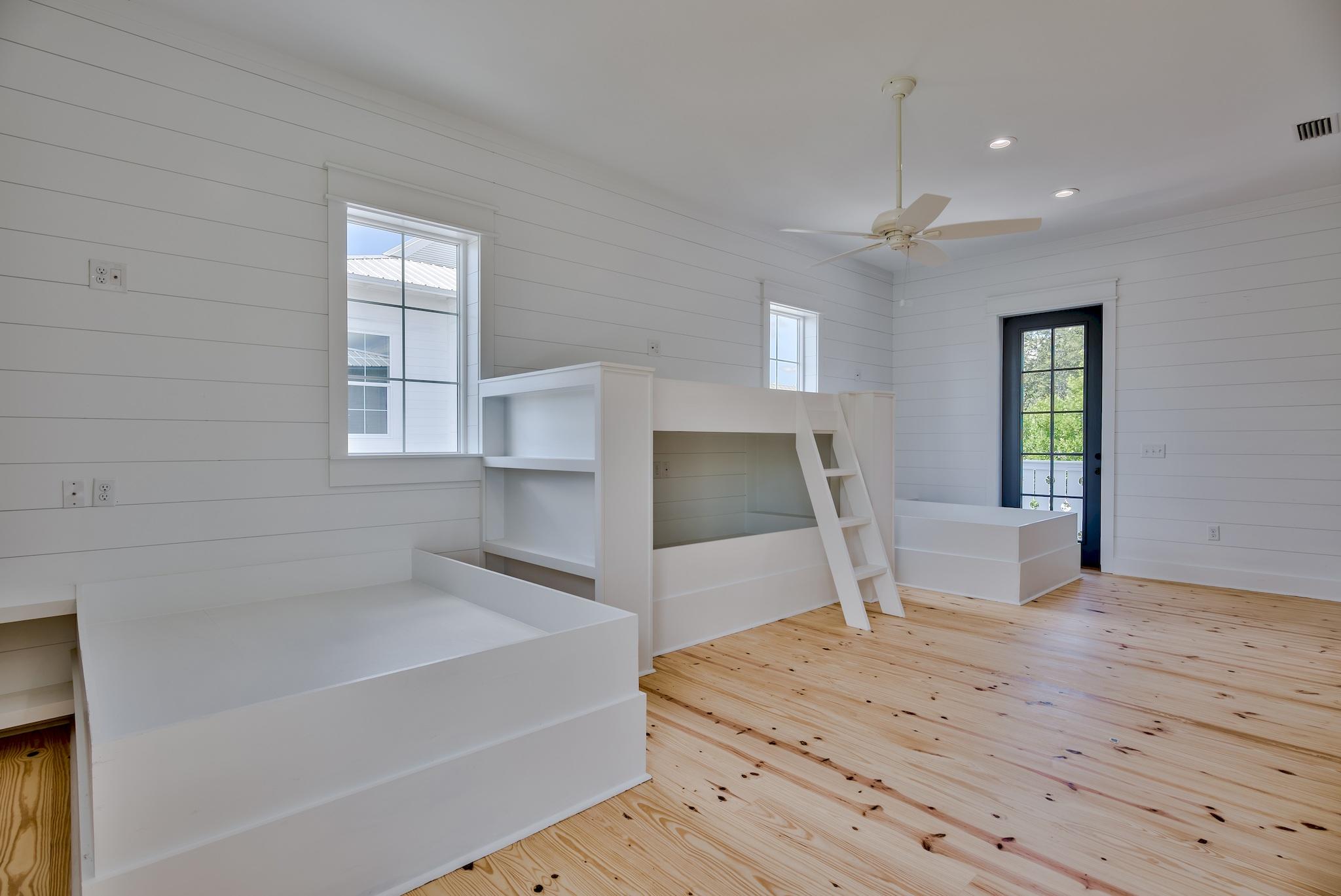 160 A St Inlet Beach Inlet Beach, FL 32461 - Photo 52 of 63 a spacious bedroom with a bed and a flat tv screen on dresser