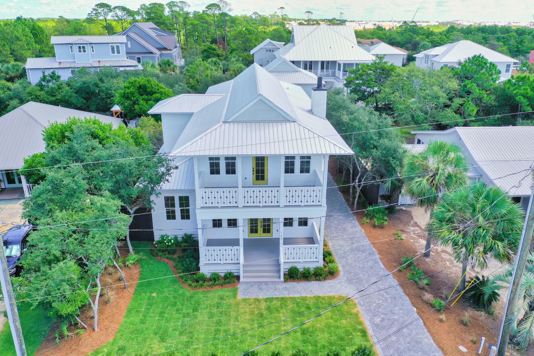 160 A St Inlet Beach Inlet Beach, FL 32461 - Photo 56 of 63 an aerial view of a house with a yard