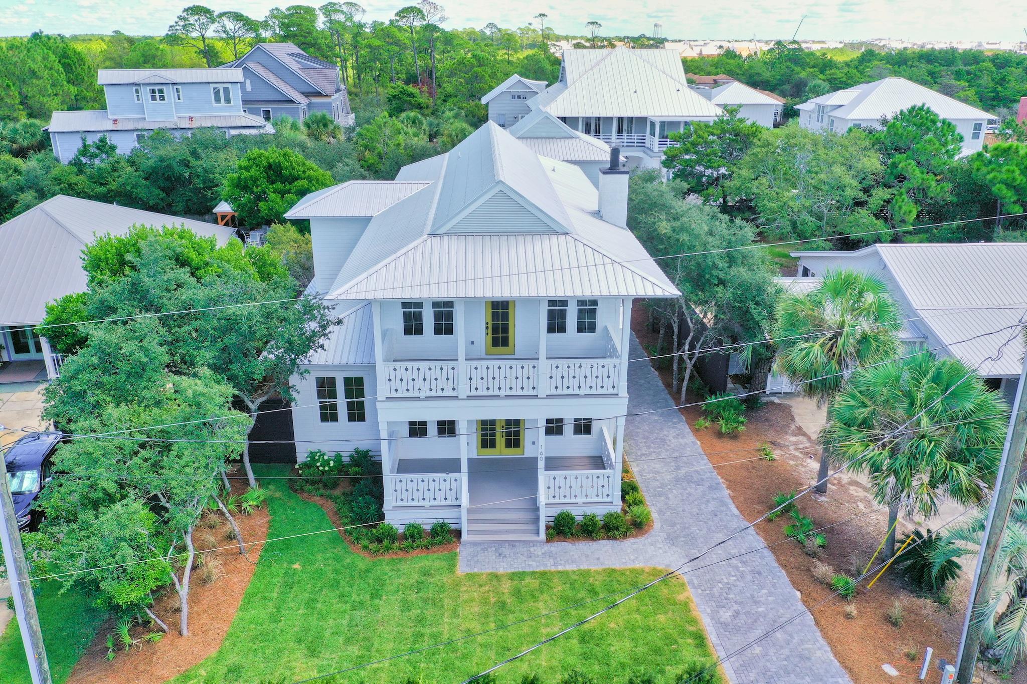 160 A St Inlet Beach Inlet Beach, FL 32461 - Photo 57 of 63 an aerial view of a house with a yard