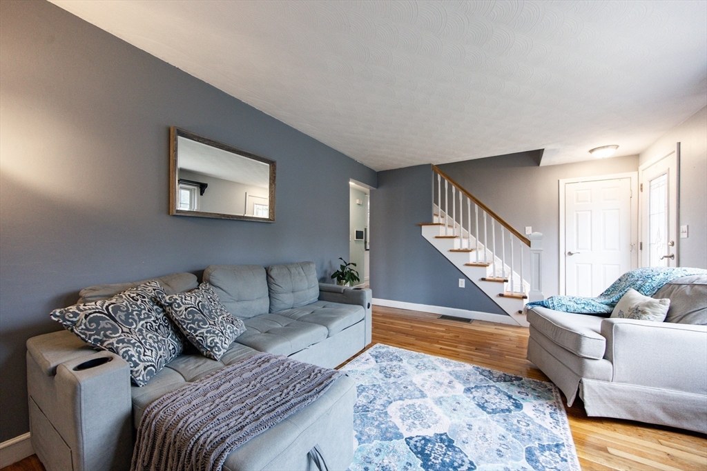 4 Jean Street Blackstone, MA 01504 - Photo 13 of 31 a living room with furniture and stairs