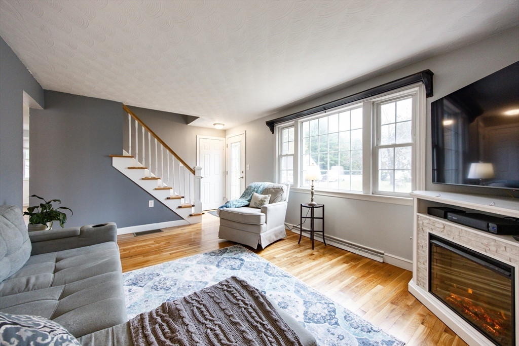 4 Jean Street Blackstone, MA 01504 - Photo 14 of 31 a living room with furniture wooden floor and a large window