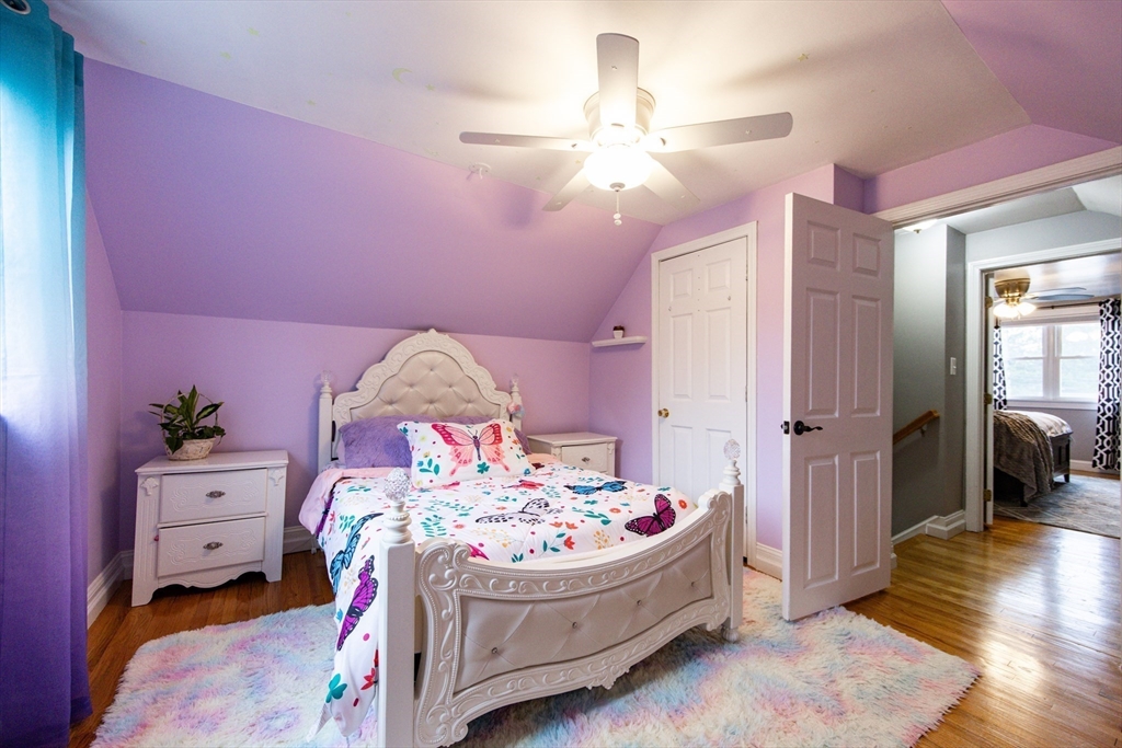 4 Jean Street Blackstone, MA 01504 - Photo 19 of 31 a bedroom with a bed and a chandelier