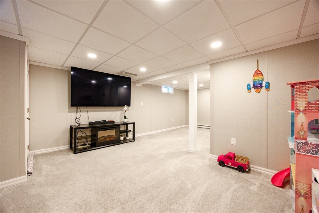4 Jean Street Blackstone, MA 01504 - Photo 26 of 31 a living room with furniture and a flat screen tv
