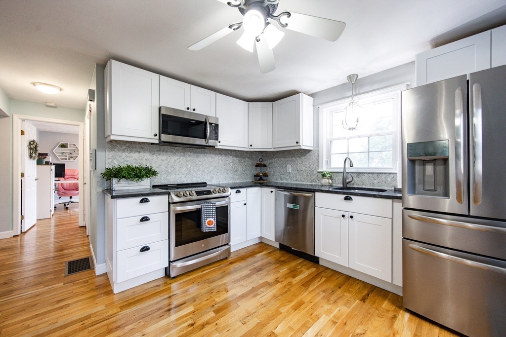 4 Jean Street Blackstone, MA 01504 - Photo 7 of 31 a kitchen with stainless steel appliances granite countertop a refrigerator and a stove top oven