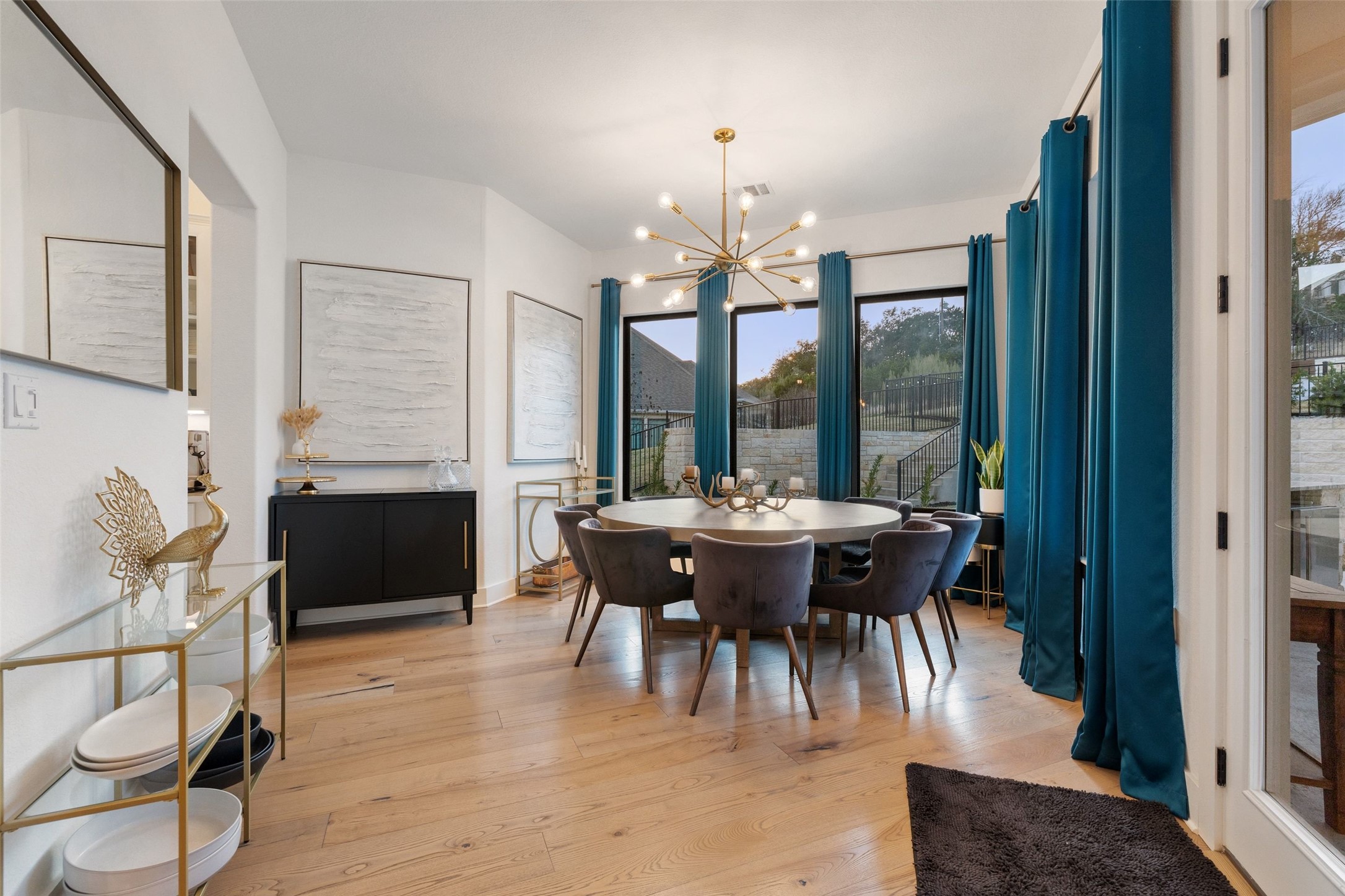 302 Lodestone Lane Austin, TX 78738 - Photo 12 of 40 a view of a dining room with furniture window and wooden floor