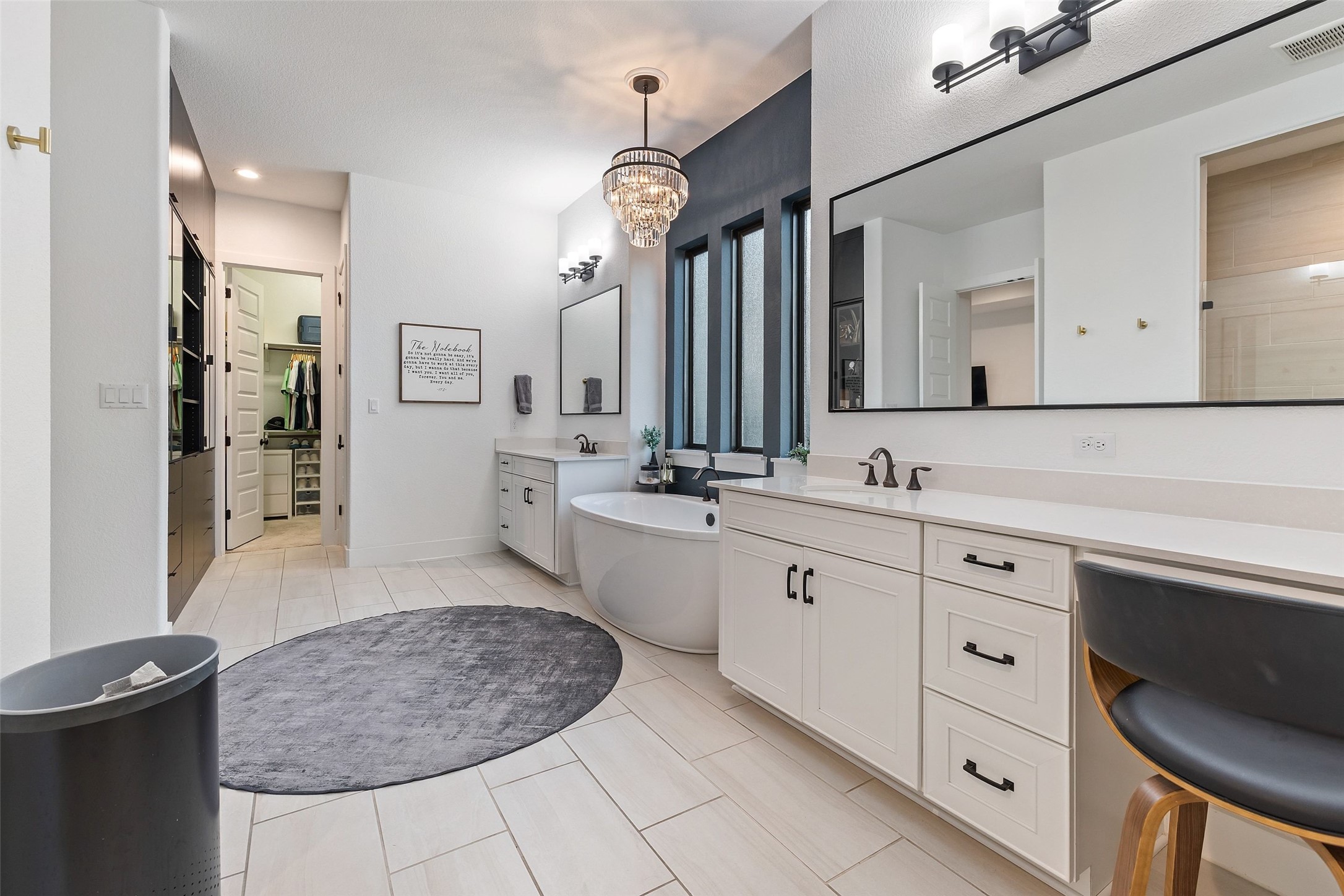 302 Lodestone Lane Austin, TX 78738 - Photo 15 of 40 a bathroom with a sink a vanity and a mirror